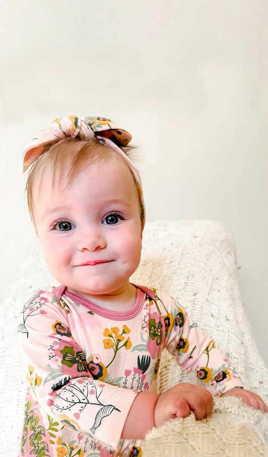 Ruffle Romper 2 Piece - Camellia worn by smiling baby girl.