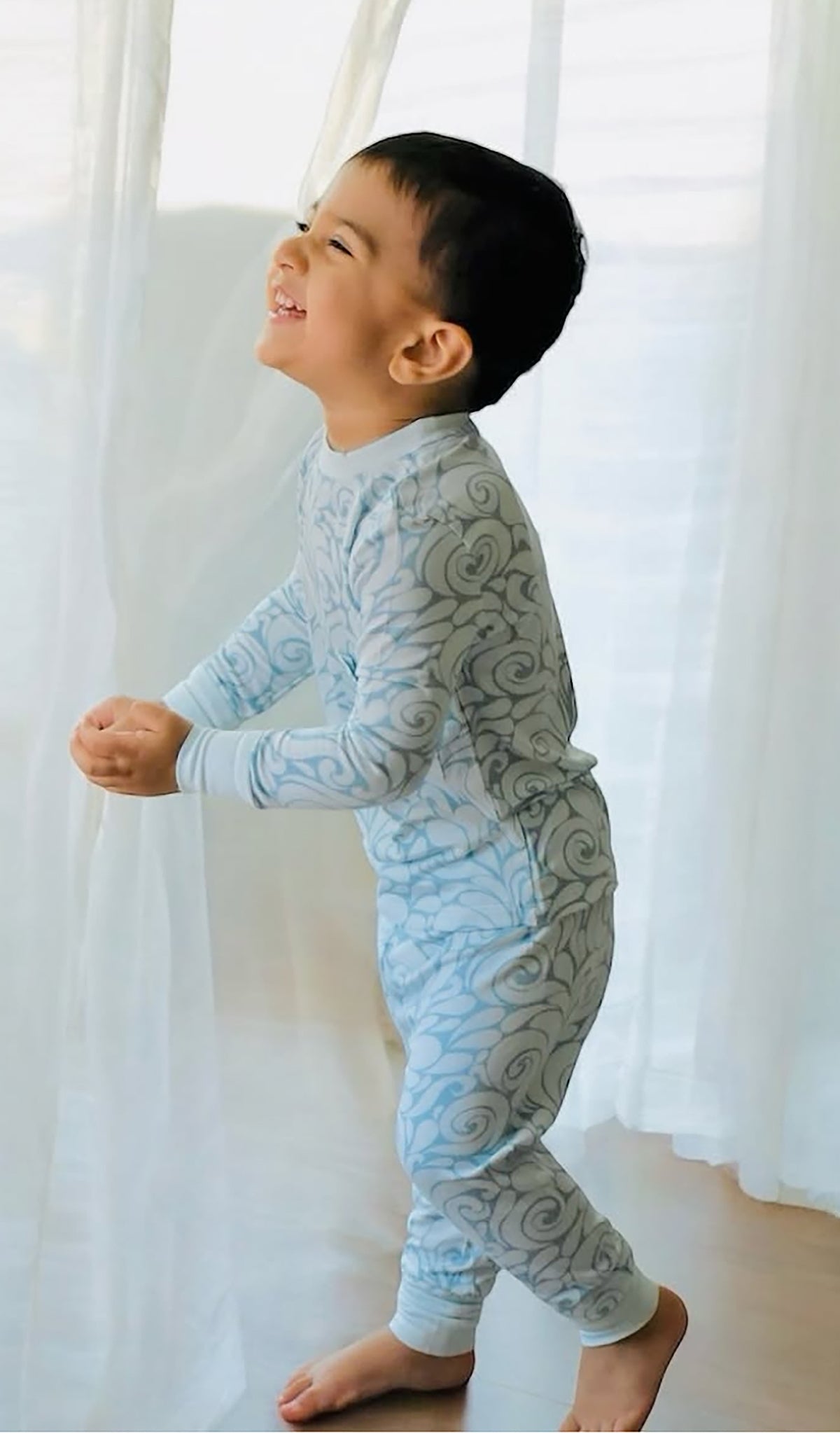 Waves Emerson 2-Piece Pant PJ worn by little boy smiling.