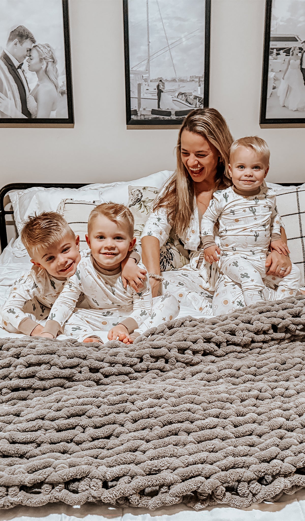 Rodeo Emerson Kids 2-Piece Pant PJ worn by 3 little boys sitting on bed with their mom.