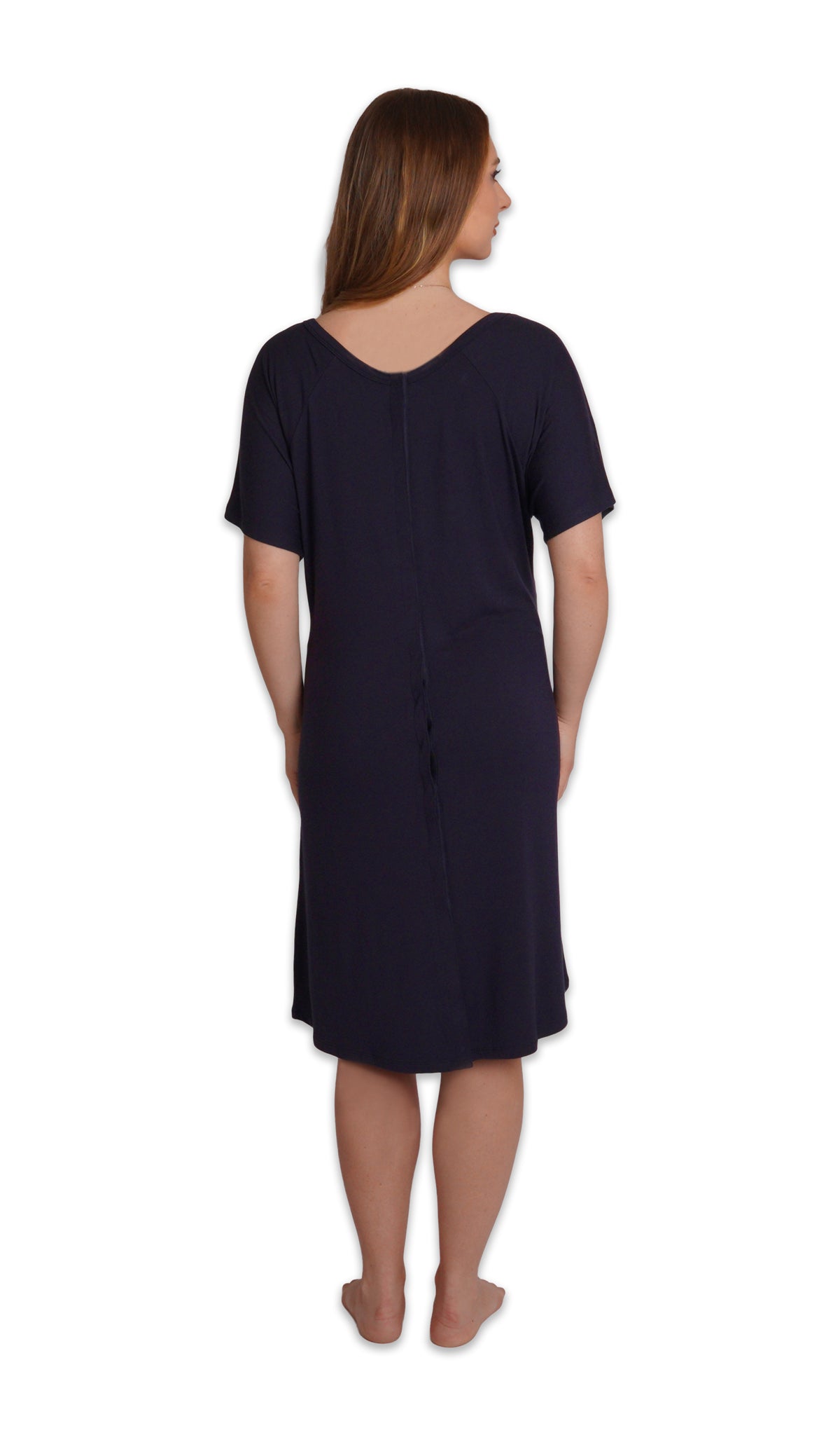 Midnight Rosa hospital gown. Back shot of woman wearing hospital gown with full-length snap-back opening.