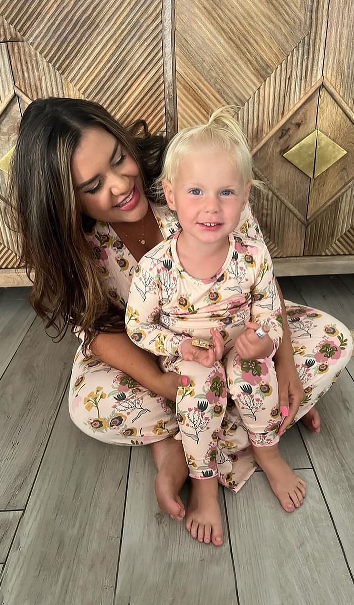 Camellia Charlie Baby 3-Piece Pant PJ worn by little girl sitting on her mom's lap. Headwrap is not shown in picture.