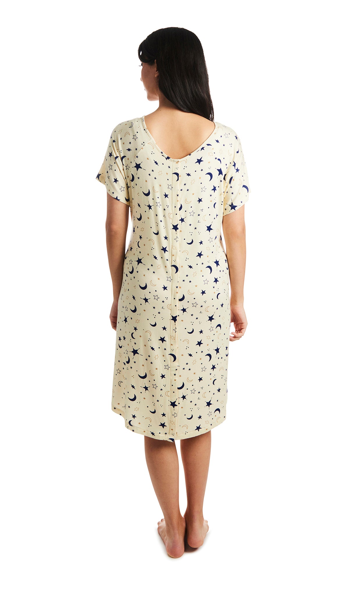 Twinkle Rosa hospital gown. Back shot of woman wearing hospital gown with full-length snap-back opening.