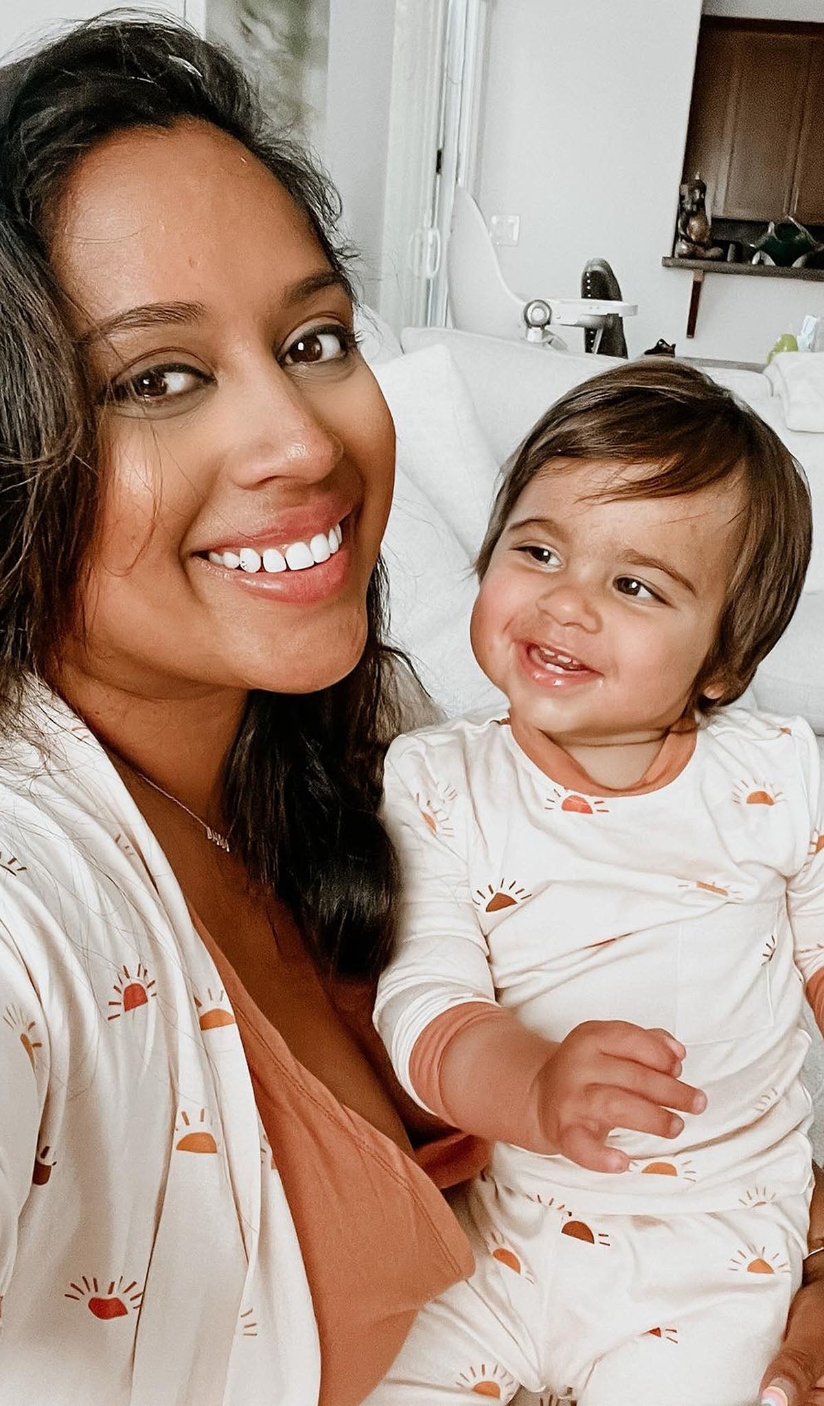 Sunrise Analise 3-Piece. Detailed shot of mother wearing robe and tank top while holding her child, who is wearing Emerson PJ in matching print.