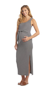 Navy Stripe Veronica maternity/nursing dress worn by pregnant woman with hand on her belly.