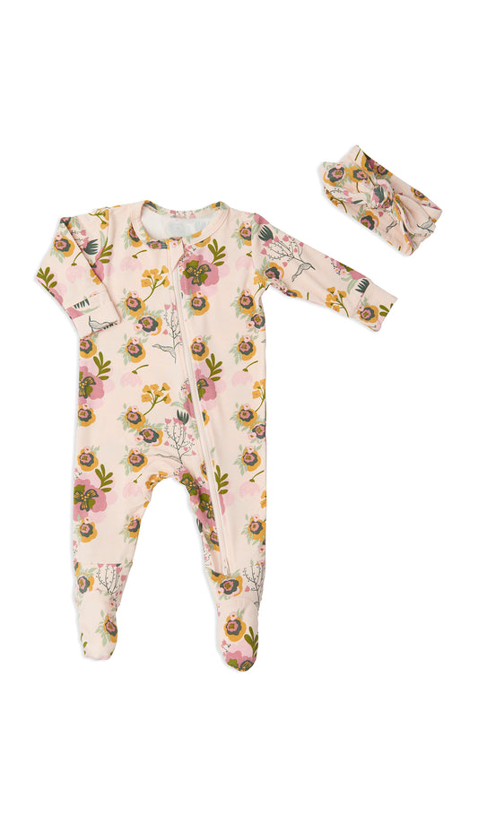 Camellia Footie 2-Piece Set. Flat shot of zip front footie for baby with matching headwrap tied into a tie-knot bow.