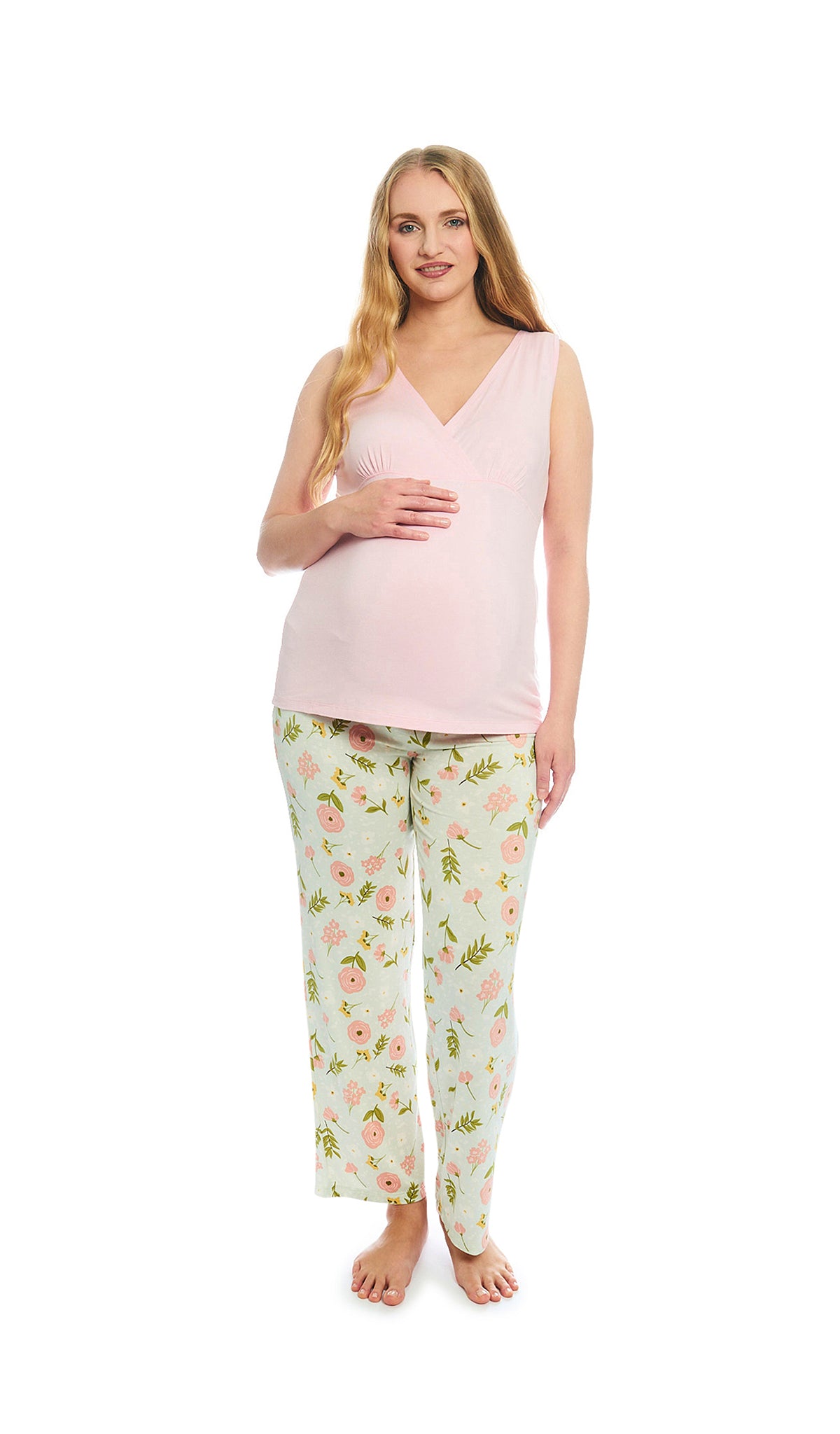 Carnation Analise 5-Piece Set, pregnant woman wearing criss-cross bust tank top and pant with one hand resting on belly.