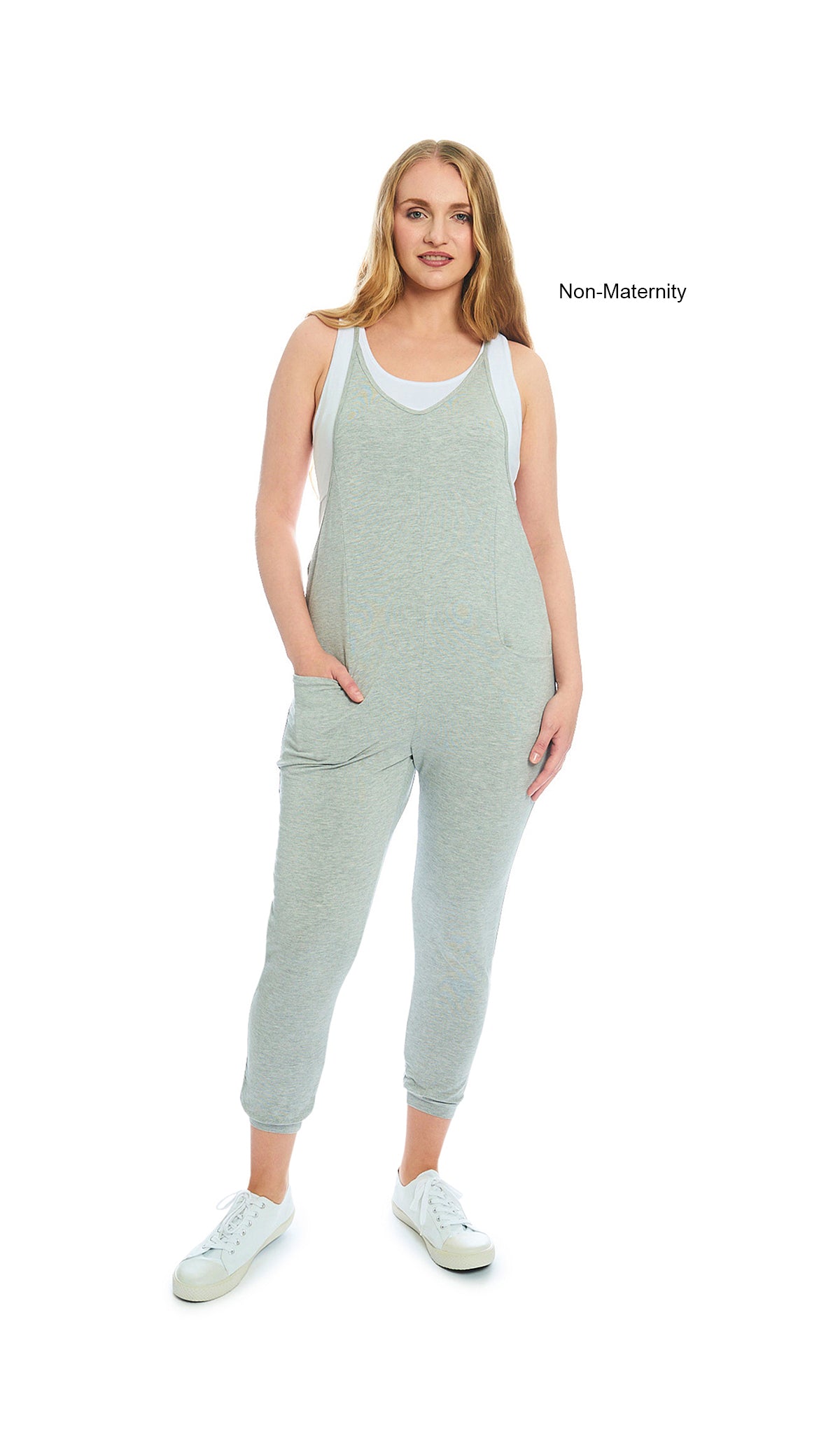 Heather Grey Solid Brandi Romper. Woman wearing Brandi romper as non-maternity over white Kara Tank with both hands in romper pockets.