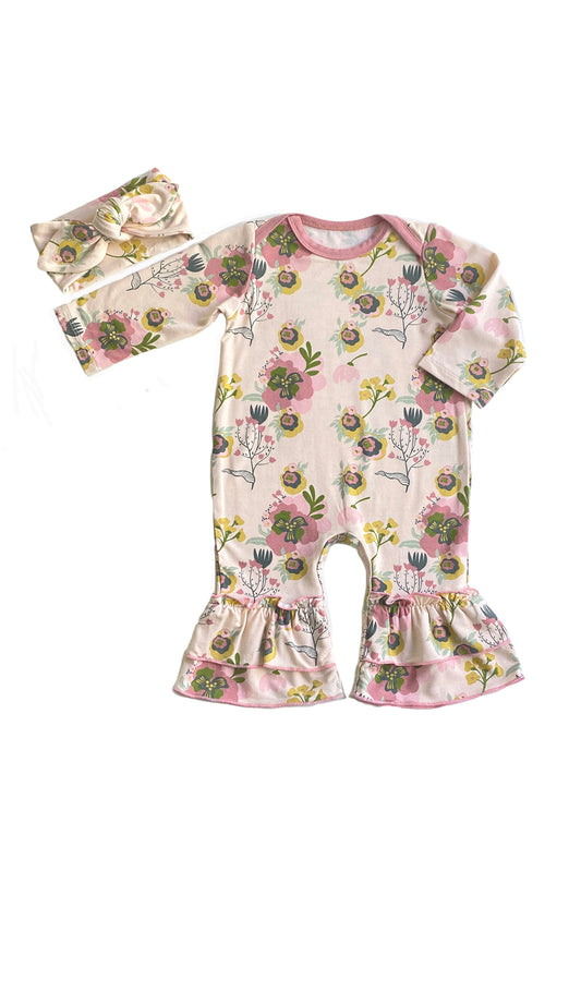 Ruffle Romper 2 Piece - Camellia. Flat shot of baby romper with ruffle trim on legs and matching headwrap.