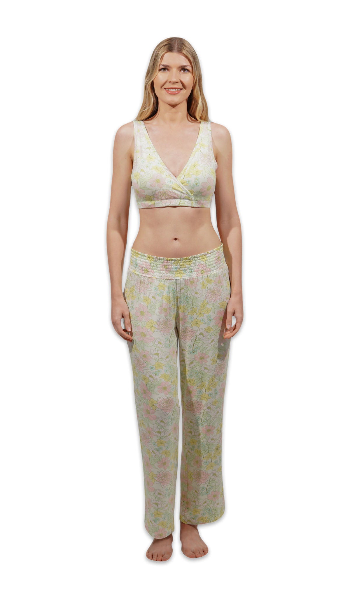 Woman wearing a floral pajama set on a white background