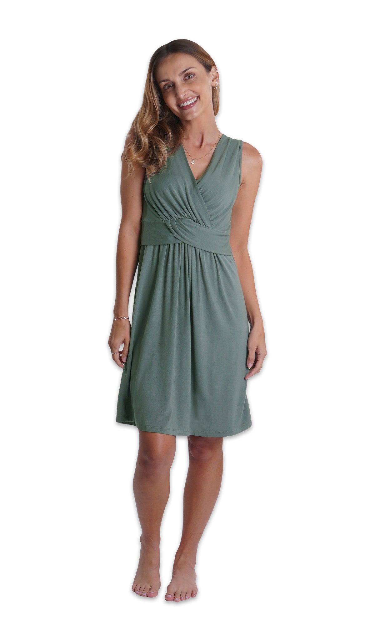 Fog Evie Nightgown. Woman wearing sleeveless nightgown with criss-cross v-neckline and empire waist that falls to knee length. 