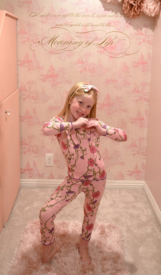 Dahlia Charlie Kids 3-Piece Pant PJ worn by little girl making a heart symbol with her hands.