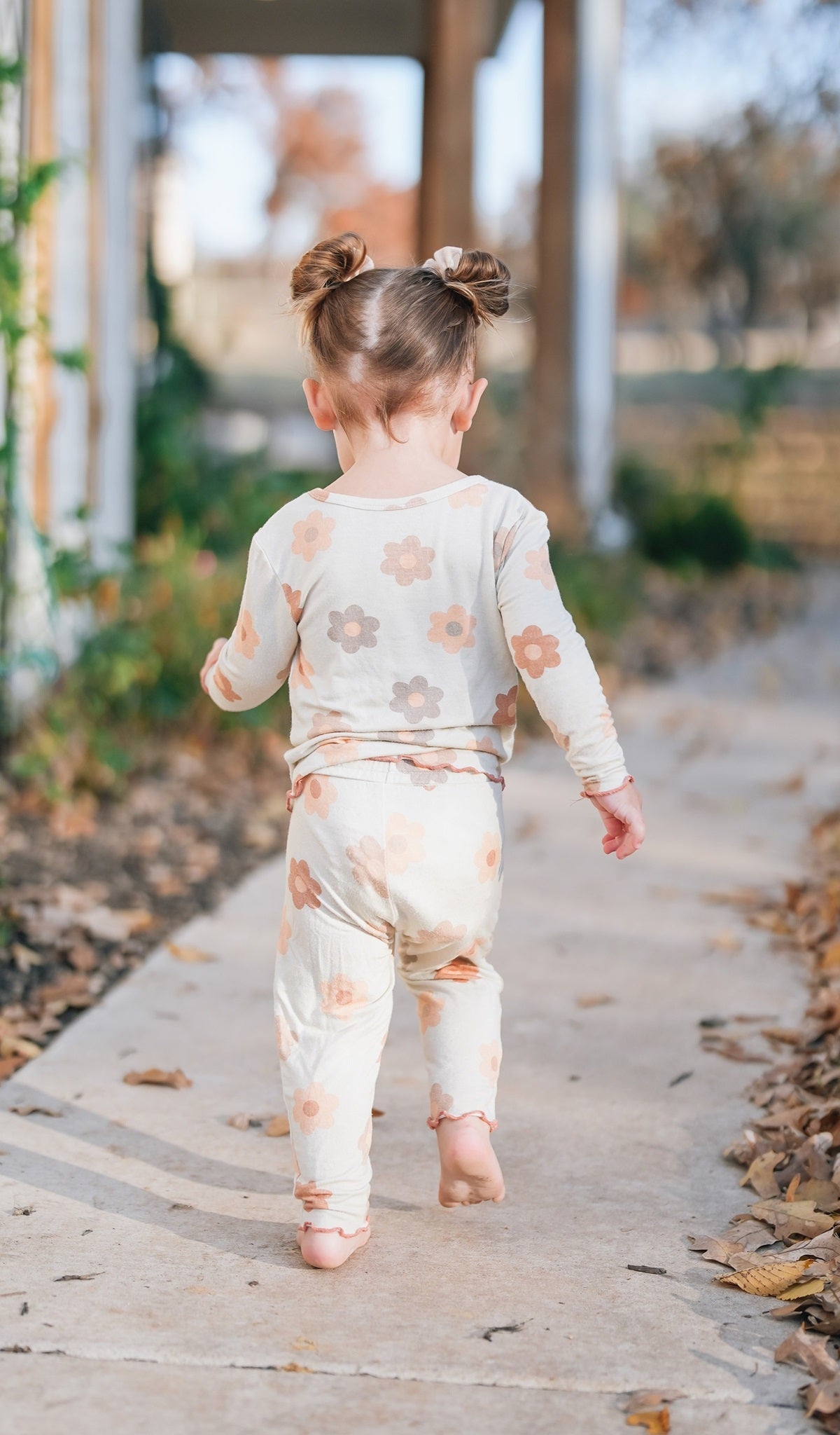 Daisies Charlie Baby 3-Piece Pant PJ worn by little girl running barefoot.