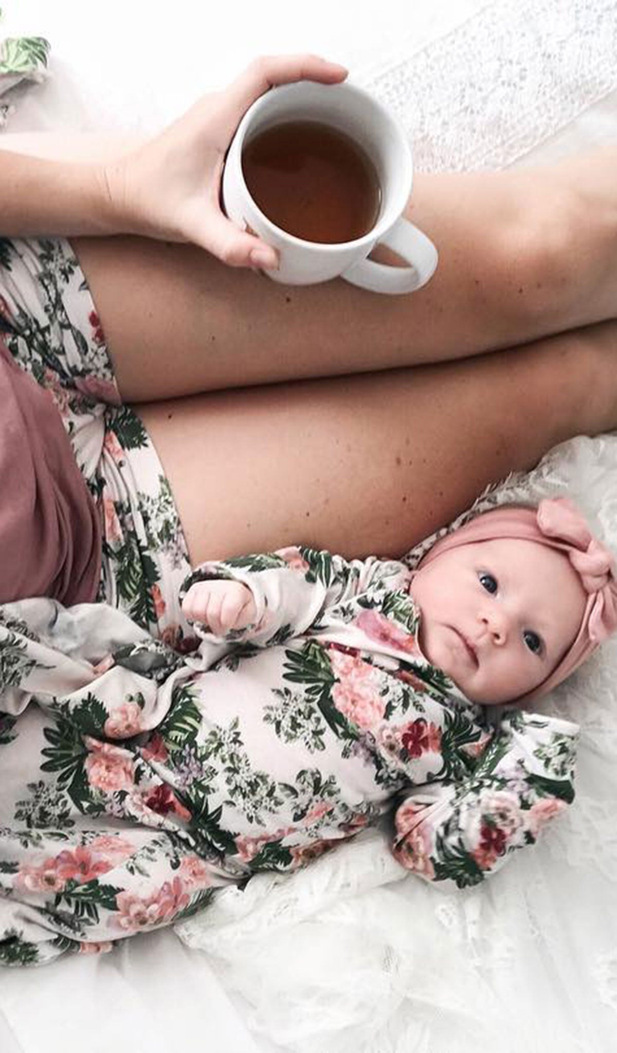 Beige Floral Adalia 5-Piece Set. Lifestyle shot of woman wearing tank top and short while sitting with her coffee cup and baby girl is next to her wearing matching baby gown.