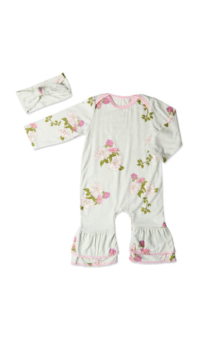 Peony Ruffle Romper 2-Piece. Flat shot of long sleeve romper with ruffles on legs and matching headwrap.