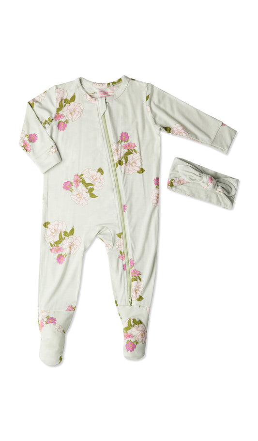 Peony Footie 2-Piece Set. Flat shot of zip front footie for baby with matching headwrap tied into a tie-knot bow.