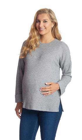 Heather Grey Andria sweater worn by pregnant woman with one hand on her belly.