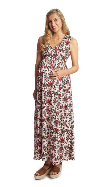 Amaryllis Valeria dress worn by pregnant woman with one hand on her belly.