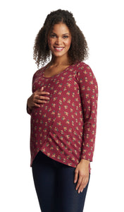 Burgundy Ditsy Adriana top worn in cropped shot by pregnant woman with dark denim jeans and with one hand on her belly.