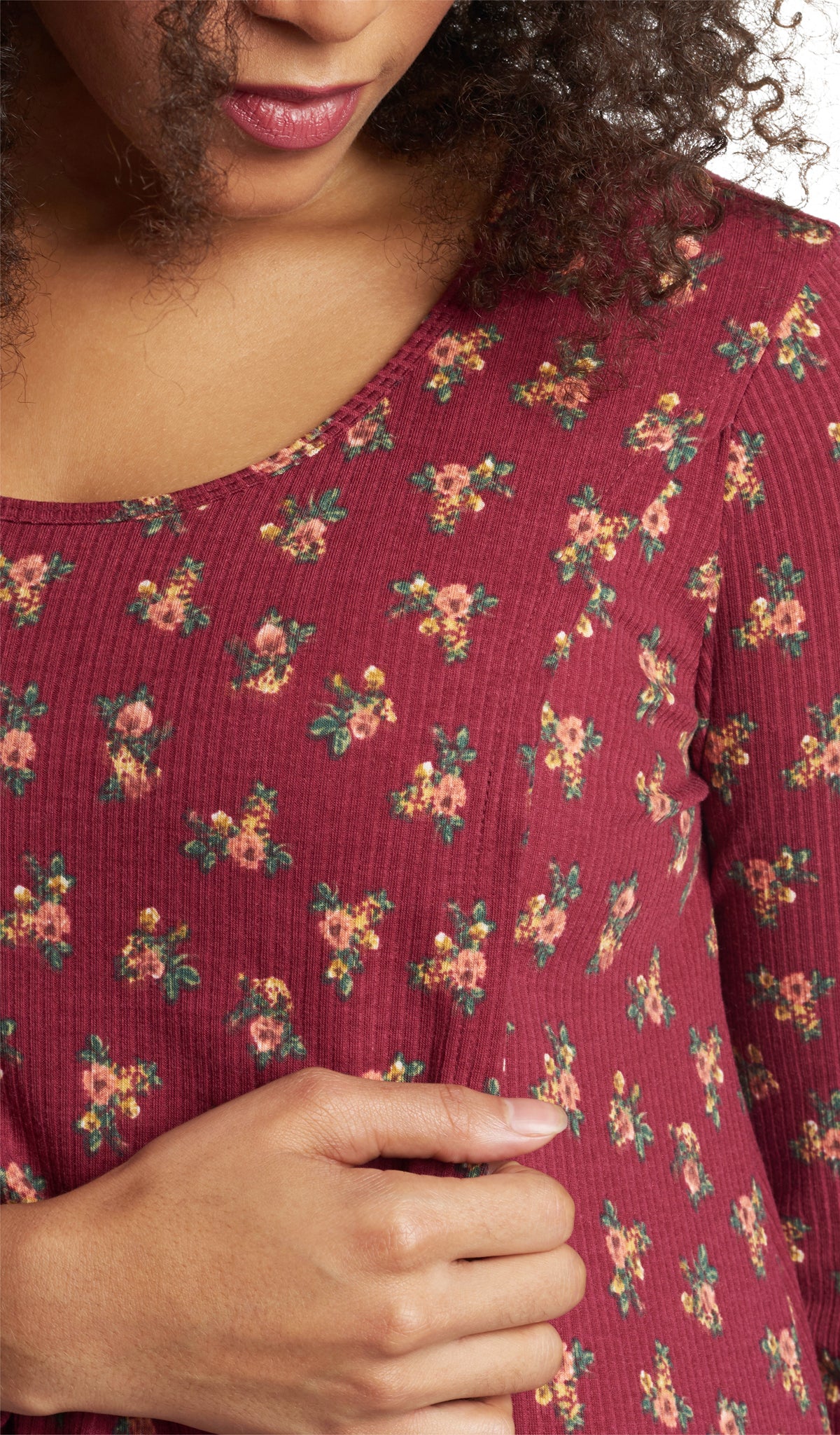 Burgundy Ditsy Adriana detail shot of woman pulling aside front panel for nursing access underneath.