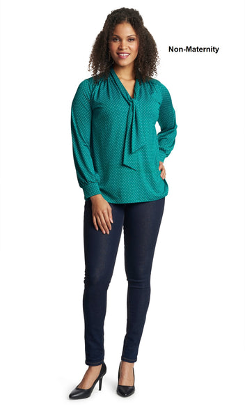 Emerald Dot Vanessa top worn by woman as non-maternity style with one hand on her hip.