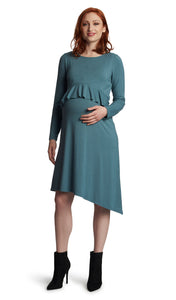 Mineral Melissa dress worn by pregnant woman with one hand on her belly.