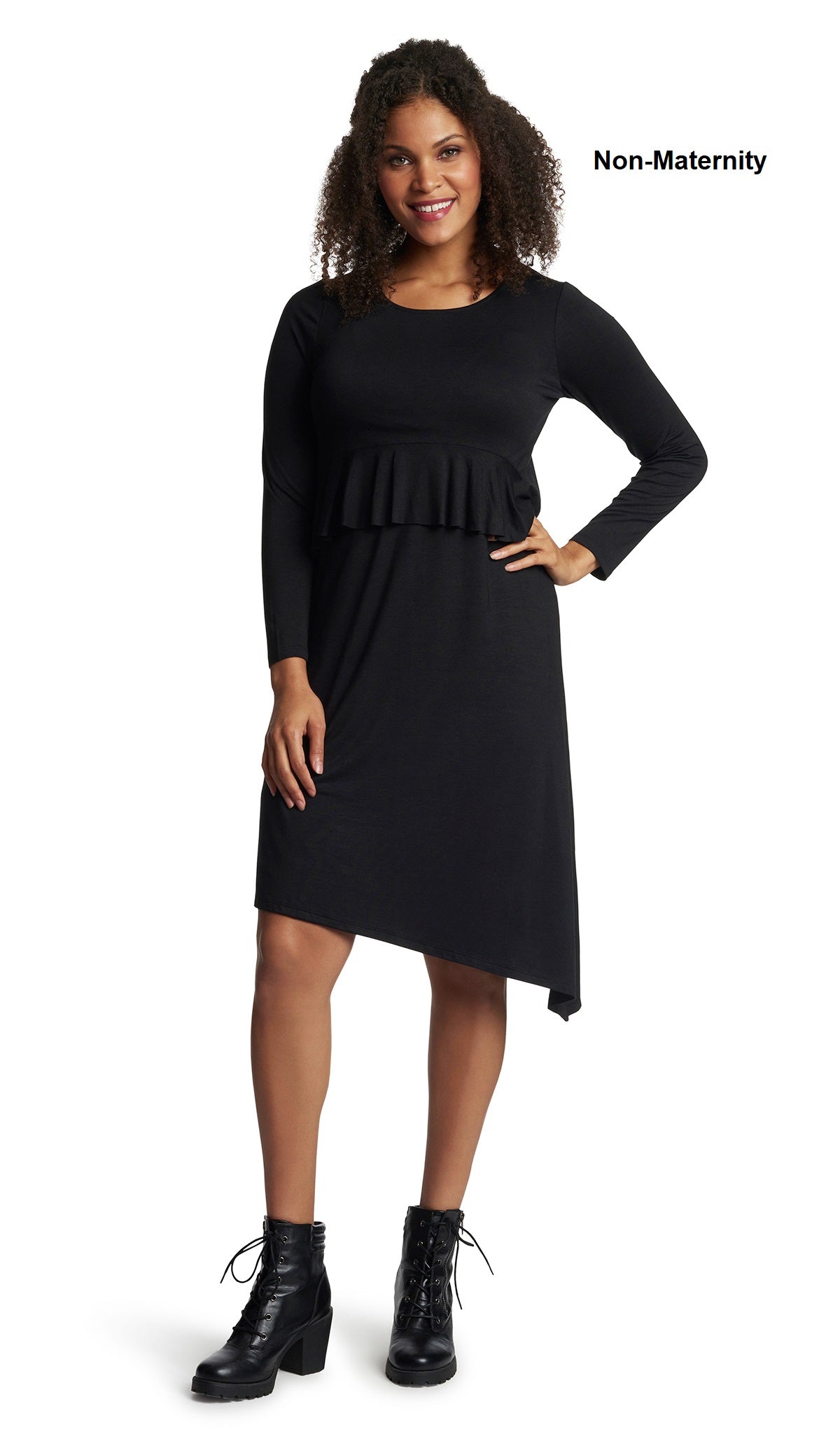 Black Melissa dress worn by woman as non-maternity style with one hand on her hip.