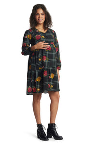 Floral Plaid Tara dress worn by pregnant woman with one hand on her belly.