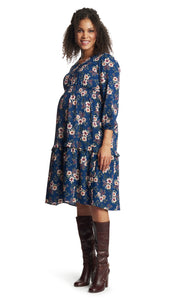 Blue Floral Jenny Dress. Pregnant woman wearing Jenny dress and knee high burgundy boots.