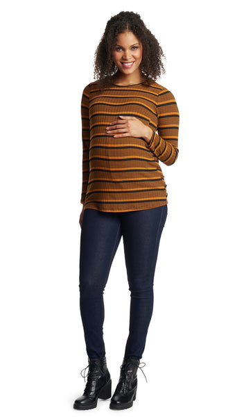 Mustard Stripe Ashley sweater worn by pregnant woman with one hand on her belly.