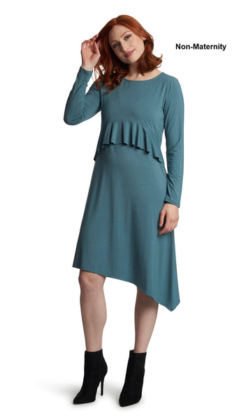 Mineral Melissa dress worn by woman as non-maternity style with one hand touching her hair.