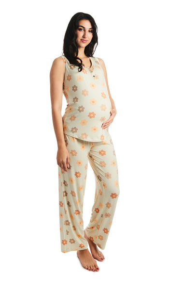 Daisies Joy 2-Piece Set. Pregnant woman wearing button front placket tank top and pant with one hand under belly.