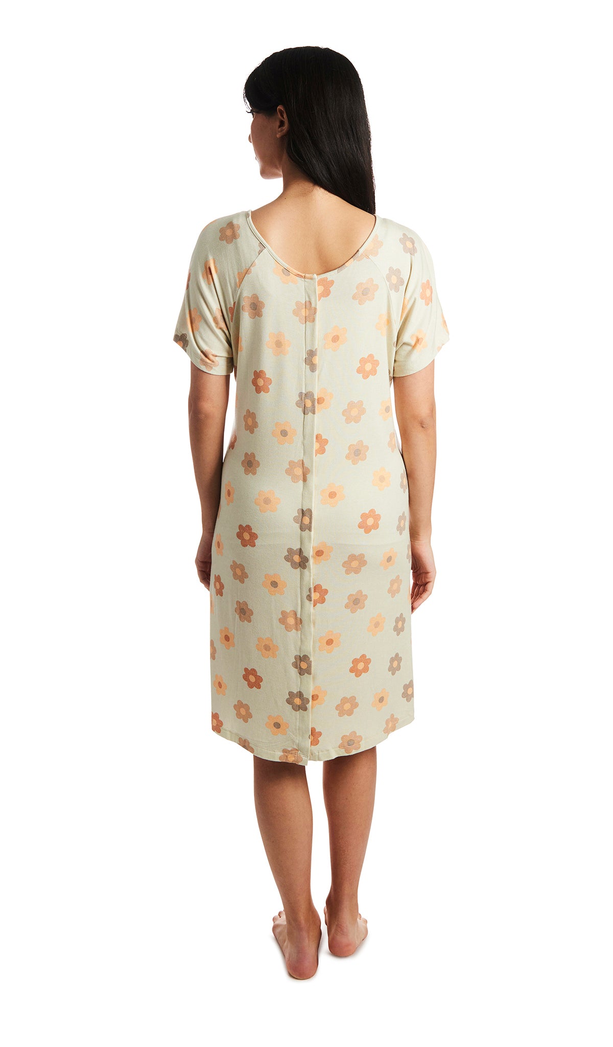 Daisies Rosa hospital gown. Back shot of woman wearing hospital gown with full-length snap-back opening.
