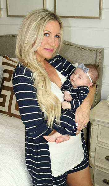 Navy Stripe Adaline 5-Piece Set, woman wearing robe, tank top and short while holding baby girl in matching baby gown.