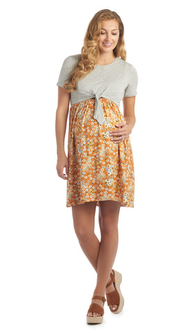 Sienna Floral Lehua 2-piece dress worn by pregnant woman with one hand on her belly.