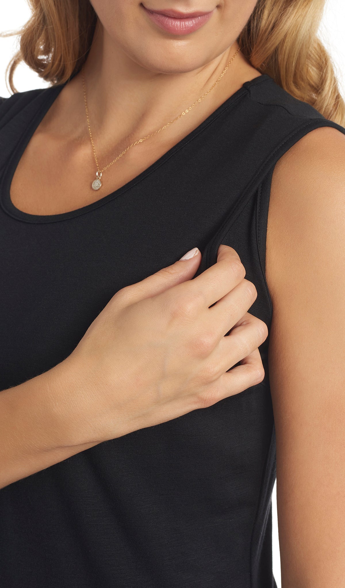 Black Tamara dress detail shot of woman pulling aside top front armhole panel to access nursing opening.