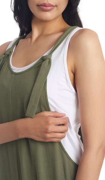 Olive Jodi overall detail shot of low side profile of overall with woman pulling up tank top for nursing access.