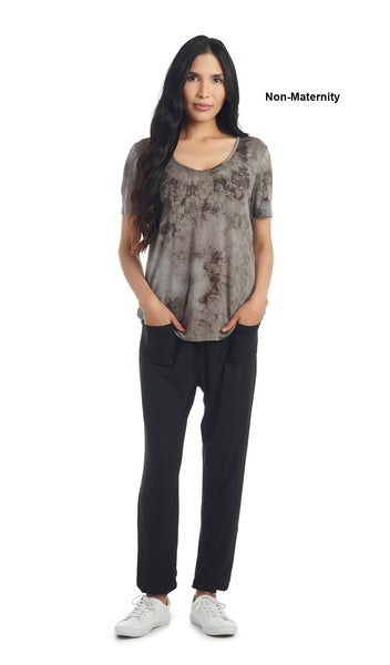 Black Tie Dye Erika tee worn by woman as non-maternity style. with her hands in her pockets.
