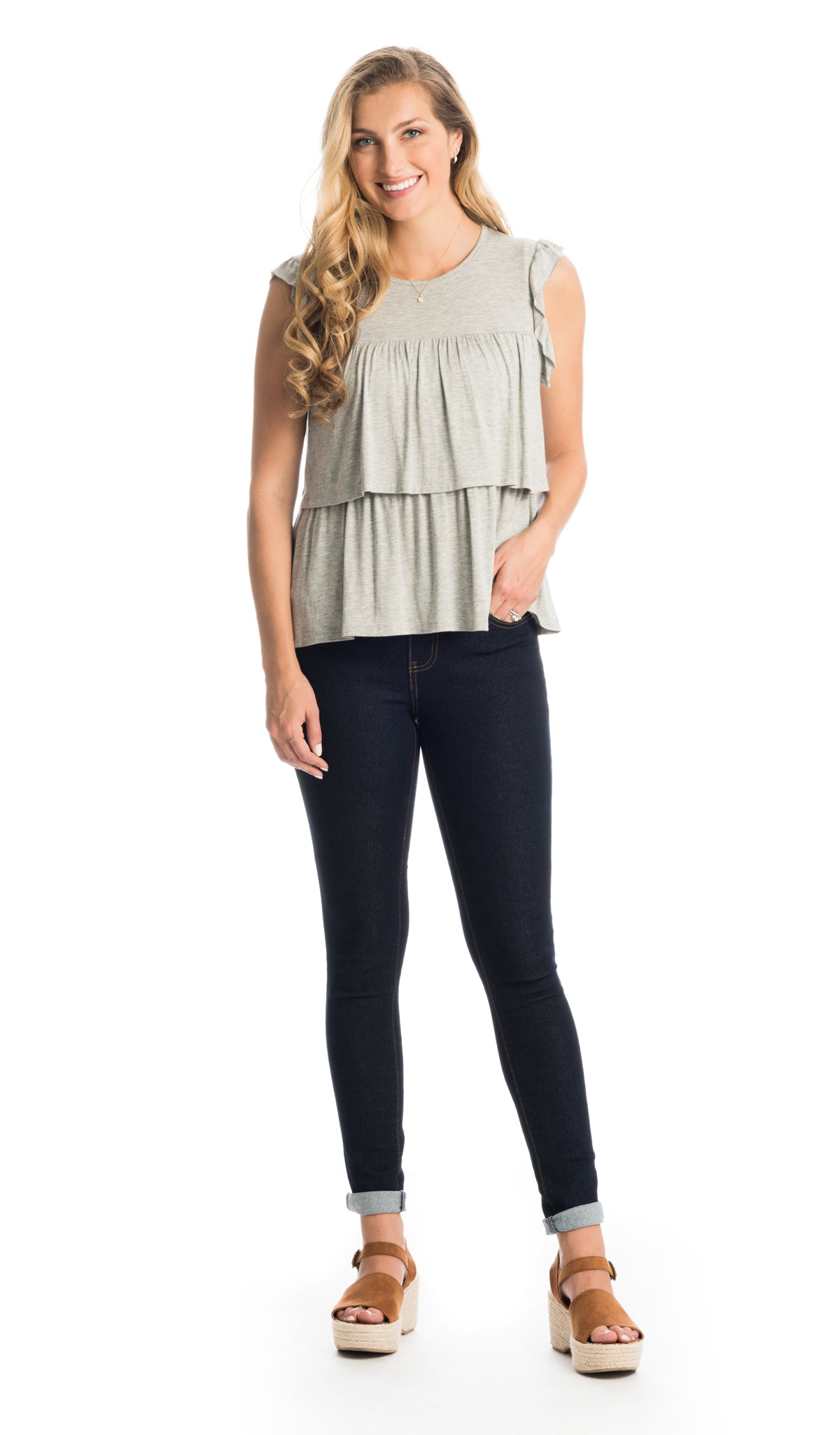 Heather Grey Valentina  top worn by woman as non-maternity style and dark denim with one hand in her pocket.