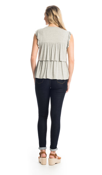 Heather Grey Valentina back shot of woman wearing top with dark denim jeans.