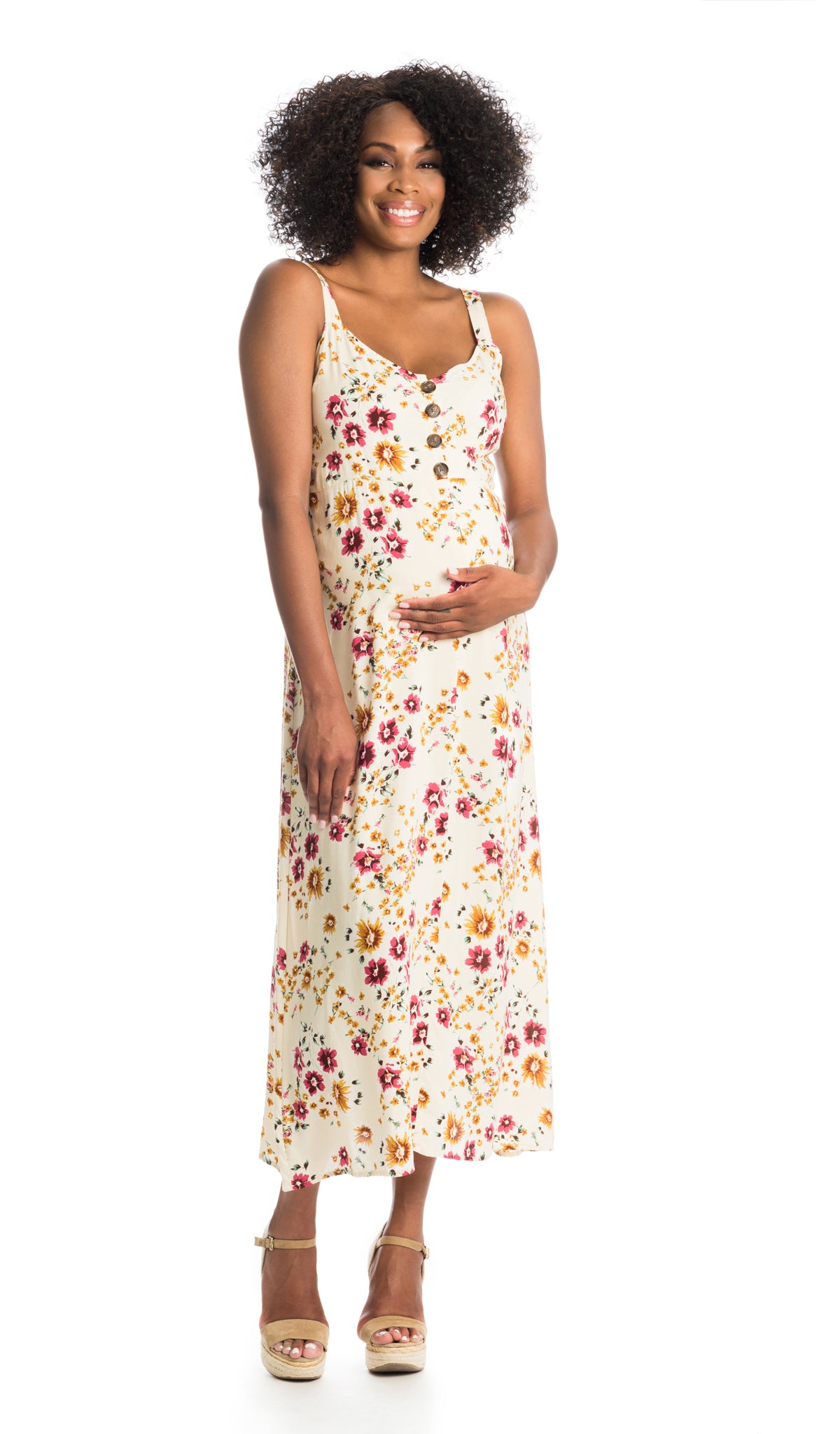 Vintage Floral Savannah dress worn by pregnant woman smiling with one hand on her belly.