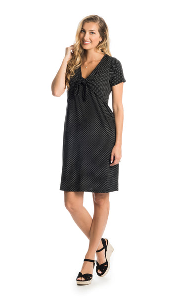 Black Dot Jada dress worn by woman as non-maternity style.