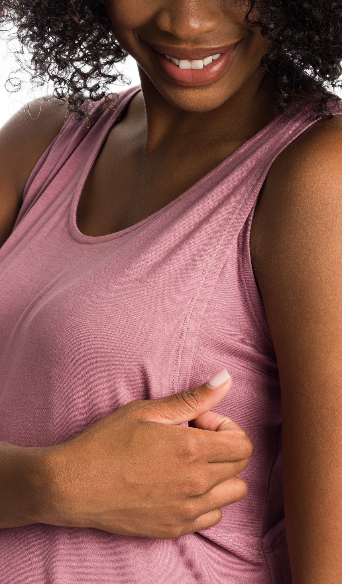 Jacqueline Mauve image of woman accessing nursing opening on solid tank top.