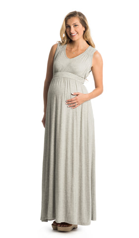 Heather Grey Valeria dress worn by pregnant woman with one hand on her belly.