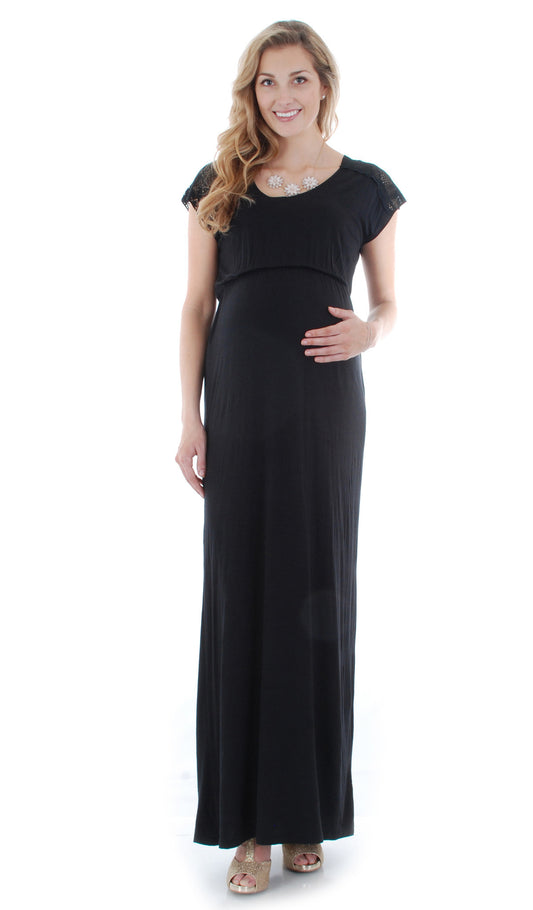 Black Abbey dress worn by pregnant woman with one hand on her belly.