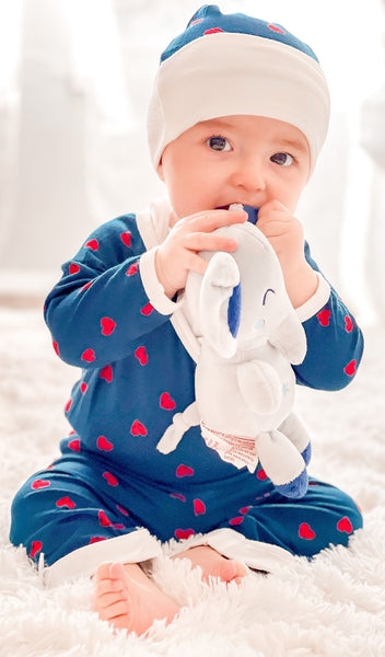 Hearts Baby's Take-Me-Home 4 Piece set worn by baby boy wearing kimono top, pant on matching hat sitting and teething on a stuffed elephant toy.