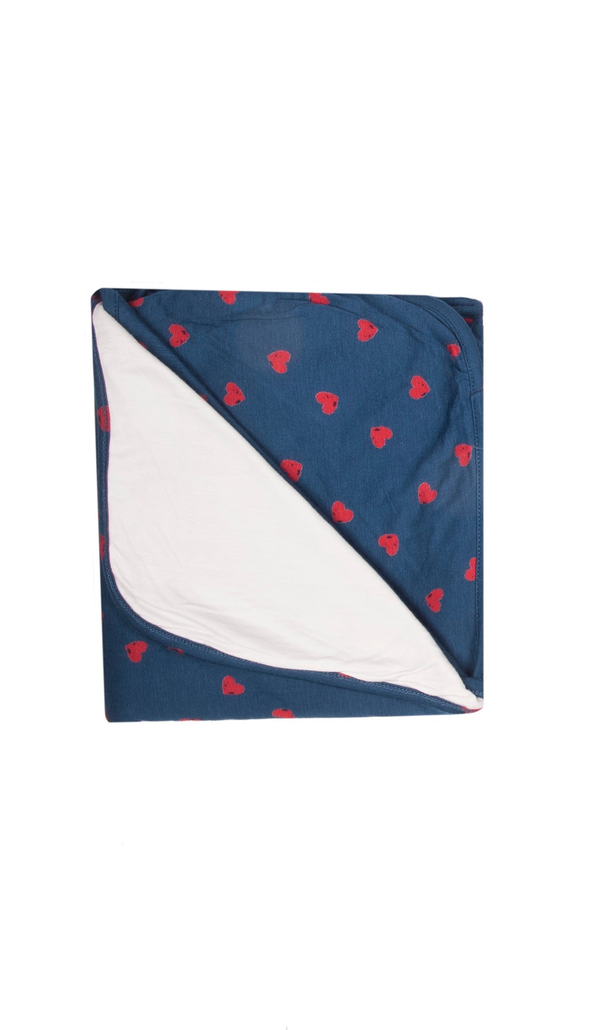 Hearts Swaddle Blanket folded into a square with print showing on one side and reversible contrast solid showing on other side of fold down flap.