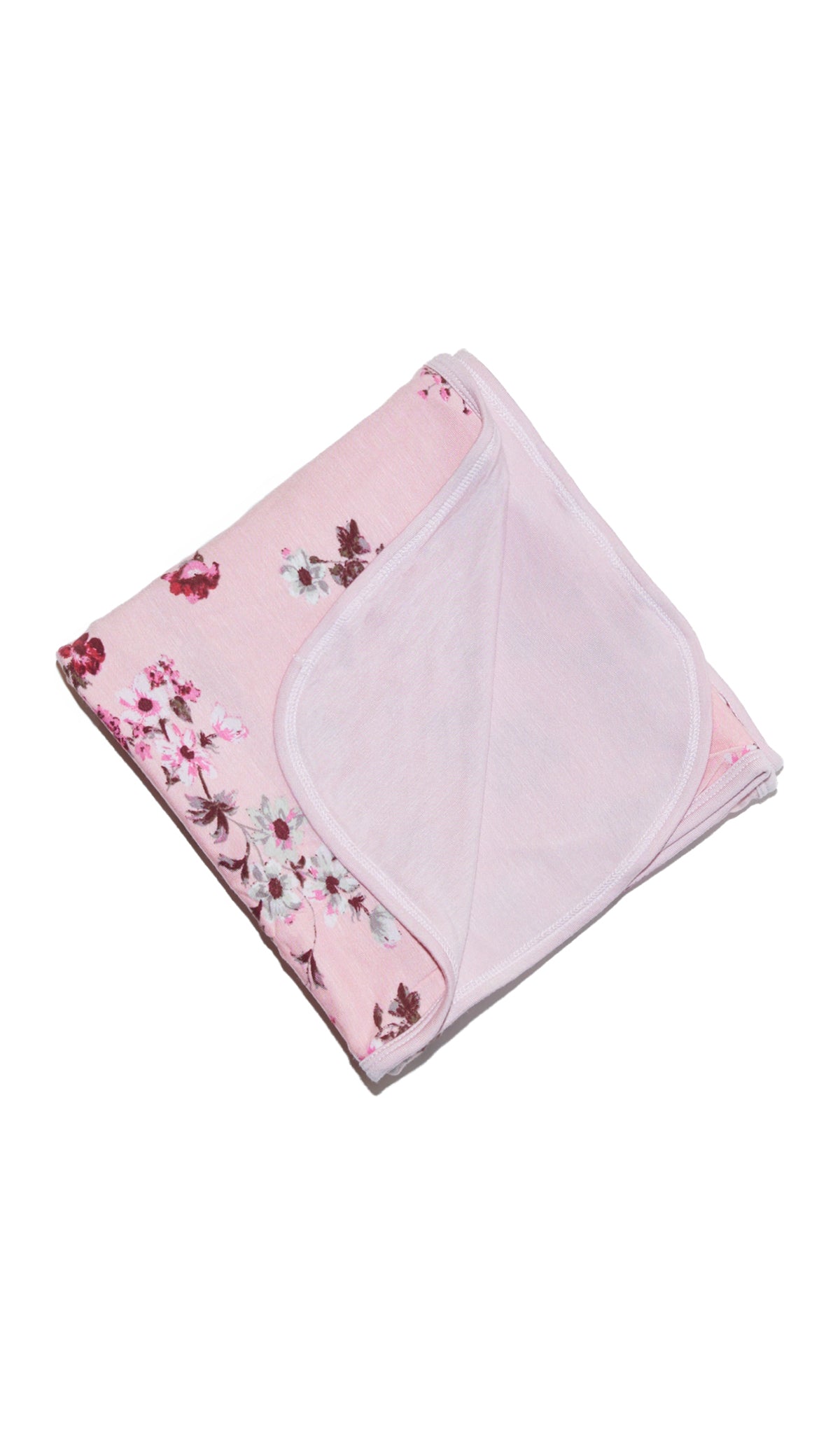 Blossom Swaddle Blanket folded into a square with print showing on one side and reversible contrast solid showing on other side of fold down flap.