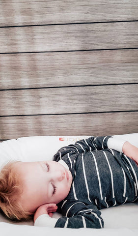 Charcoal Emerson Baby 2-Piece Pant PJ. Lifestyle shot of boy sleeping on back wearing Emerson.
