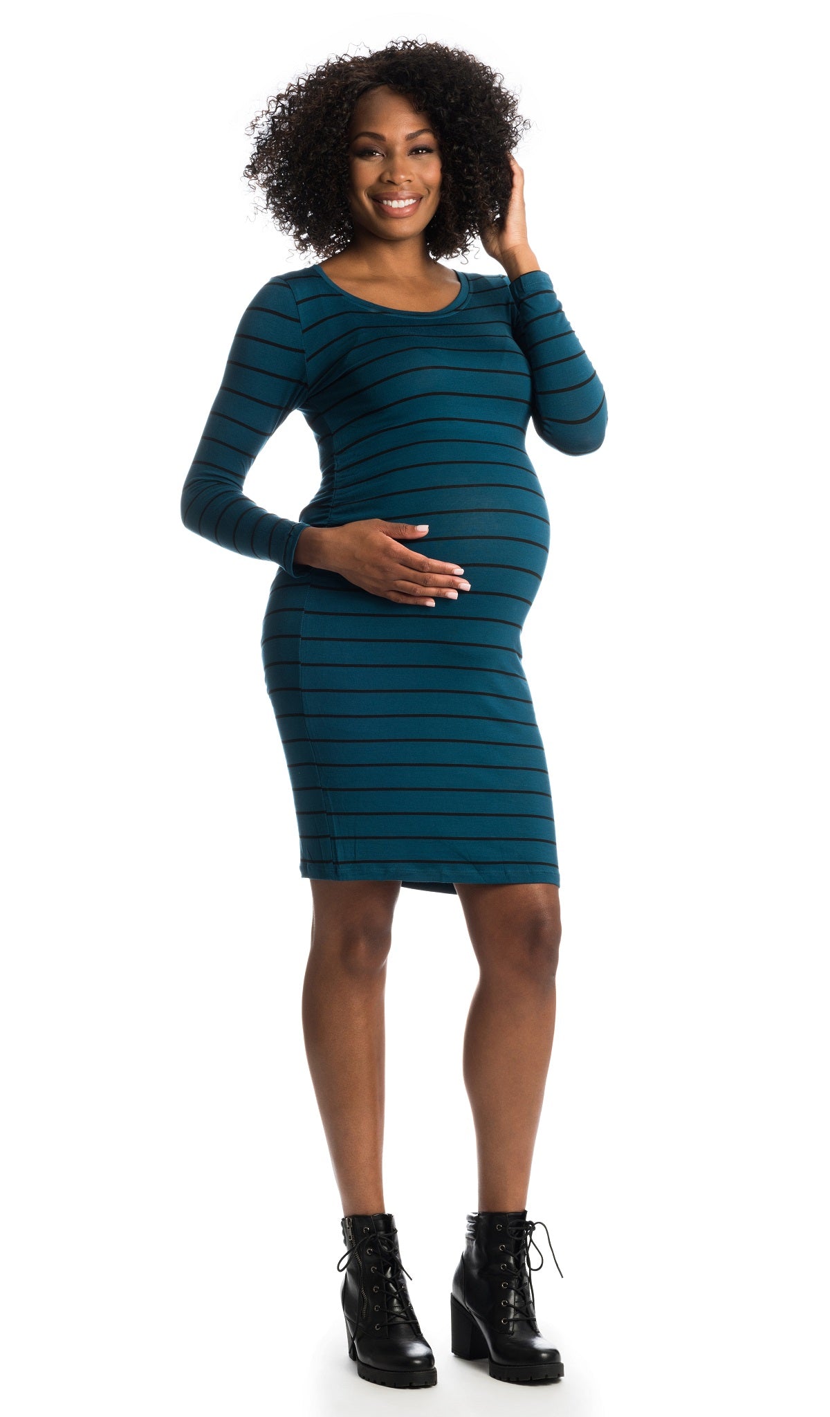 Teal Stripe Hanh dress worn by pregnant woman with one hand on her belly.