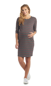 Wine Stripe Estela dress worn by pregnant woman with one hand on her belly.